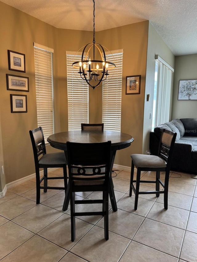 5040 Rock Rose Loop, Sanford, FL 32771 - dining area with a chandelier, a textured ceiling, and light tile patterned floors