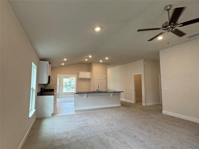 3891 Sagefield Dr, Harmony, FL 34773 - unfurnished living room with light carpet, recessed lighting, a ceiling fan, and vaulted ceiling