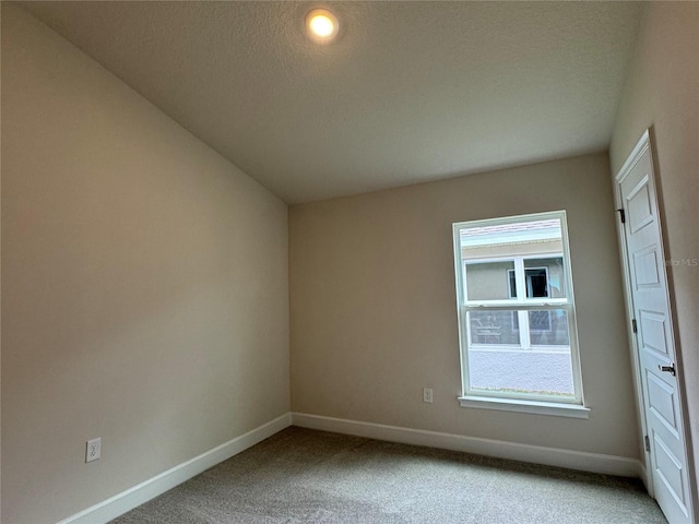 3891 Sagefield Dr, Harmony, FL 34773 - carpeted empty room featuring baseboards and a textured ceiling