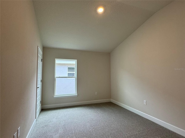 3891 Sagefield Dr, Harmony, FL 34773 - carpeted spare room featuring baseboards and vaulted ceiling