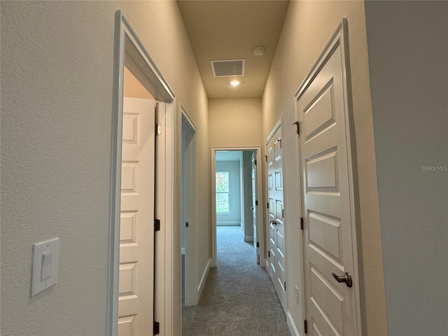 3891 Sagefield Dr, Harmony, FL 34773 - corridor featuring carpet flooring and a textured wall