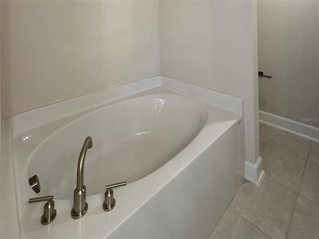 3891 Sagefield Dr, Harmony, FL 34773 - bathroom with tile patterned floors and a garden tub