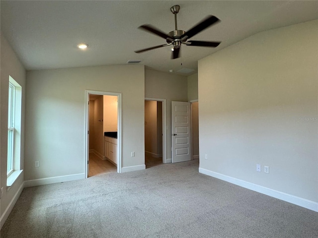 3891 Sagefield Dr, Harmony, FL 34773 - unfurnished bedroom with lofted ceiling, light carpet, connected bathroom, a ceiling fan, and recessed lighting