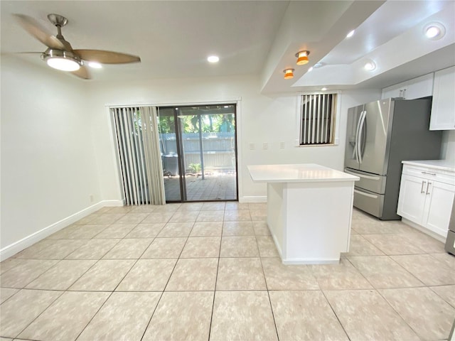 508 Sandtree, Palm Beach Gardens, FL 33403 - kitchen with a ceiling fan, stainless steel fridge, light countertops, white cabinetry, and light tile patterned floors