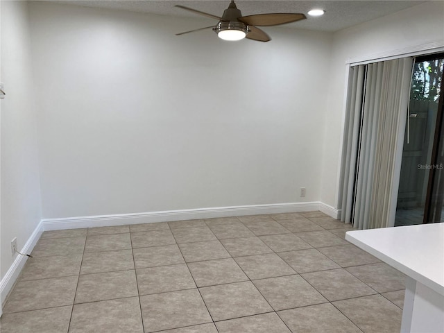 508 Sandtree, Palm Beach Gardens, FL 33403 - empty room with a ceiling fan and light tile patterned floors