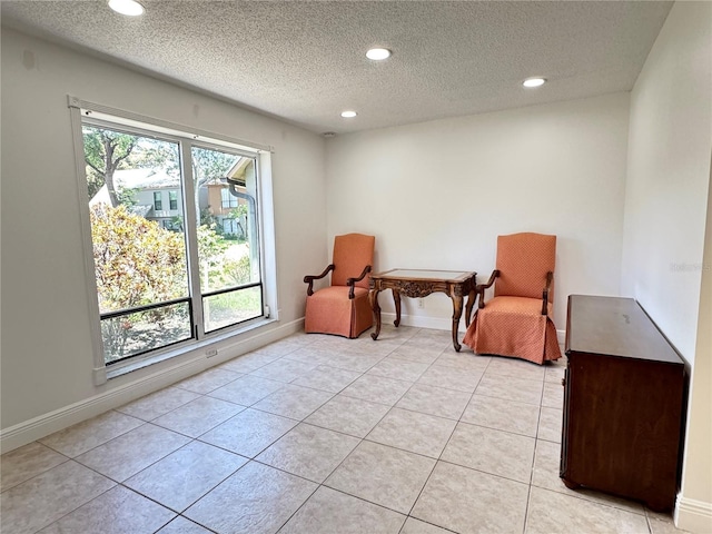 508 Sandtree, Palm Beach Gardens, FL 33403 - sitting room featuring recessed lighting, a textured ceiling, and light tile patterned floors