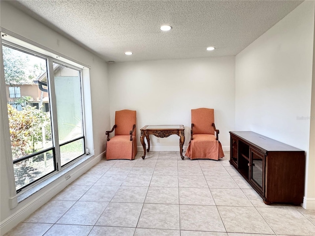 508 Sandtree, Palm Beach Gardens, FL 33403 - sitting room featuring a textured ceiling, recessed lighting, and light tile patterned floors