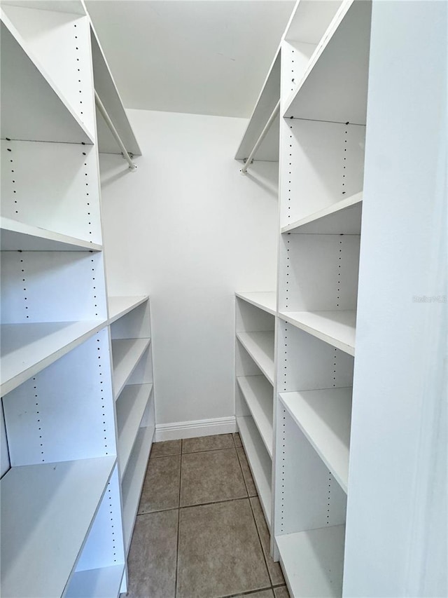 508 Sandtree, Palm Beach Gardens, FL 33403 - walk in closet featuring tile patterned flooring