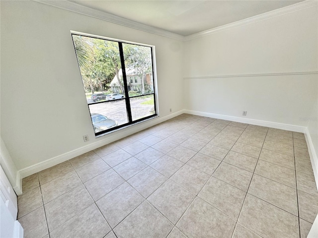 508 Sandtree, Palm Beach Gardens, FL 33403 - spare room featuring light tile patterned floors and crown molding