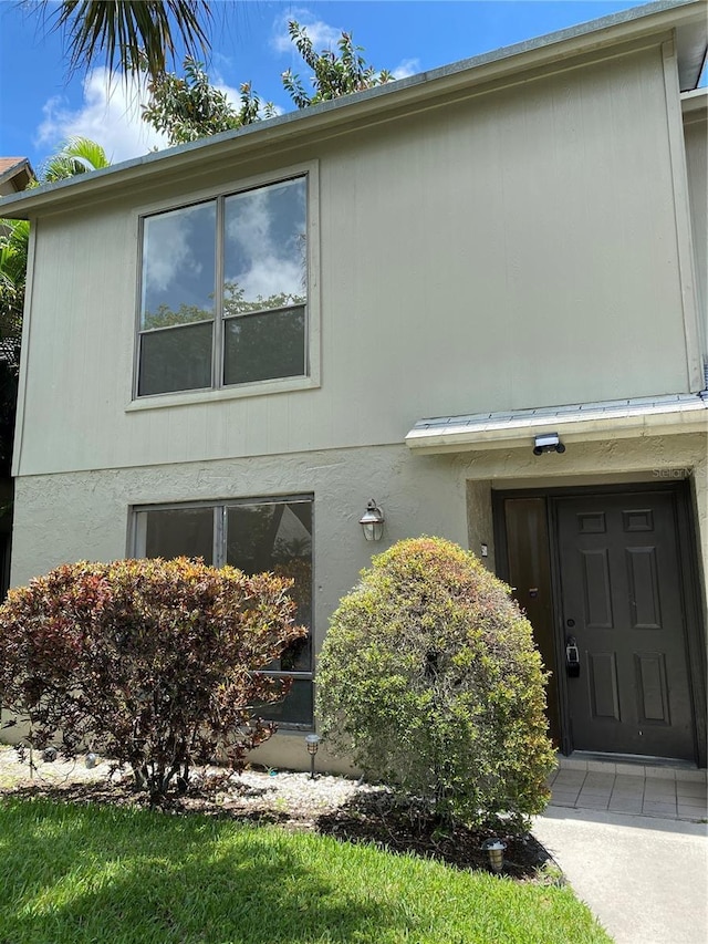 508 Sandtree, Palm Beach Gardens, FL 33403 - view of side of property featuring stucco siding