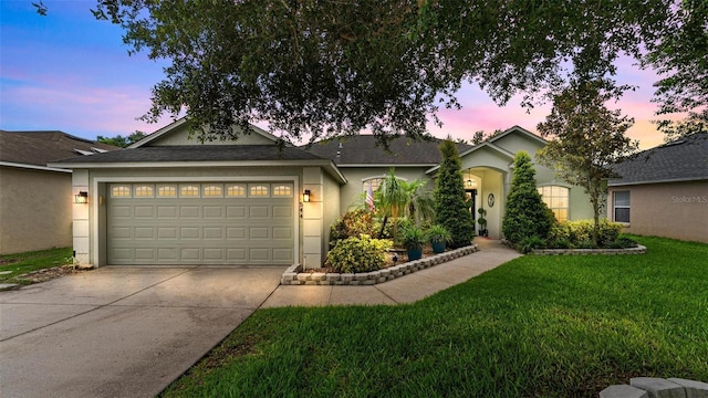 544 Lake Sumner Dr, Groveland, FL 34736 - ranch-style house with driveway, a garage, stucco siding, and a lawn