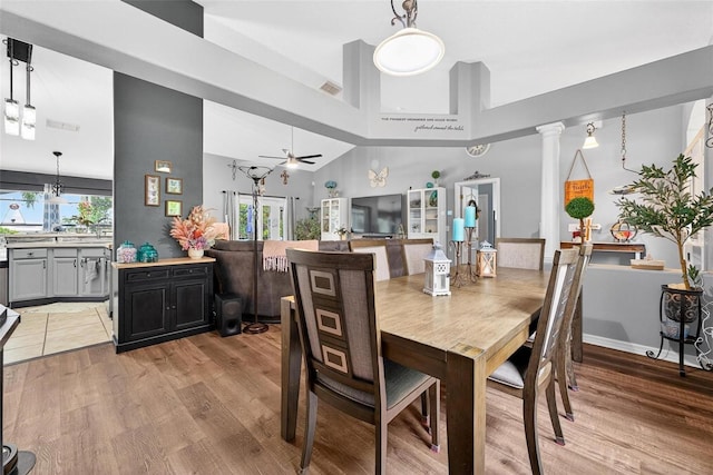 544 Lake Sumner Dr, Groveland, FL 34736 - dining space with a ceiling fan, light wood-style flooring, and a towering ceiling