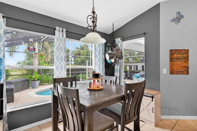 544 Lake Sumner Dr, Groveland, FL 34736 - dining area featuring lofted ceiling and light tile patterned flooring
