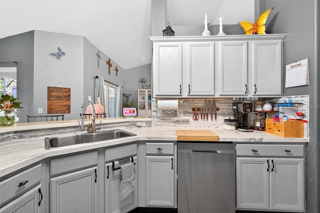 544 Lake Sumner Dr, Groveland, FL 34736 - kitchen featuring stainless steel dishwasher, gray cabinetry, and vaulted ceiling