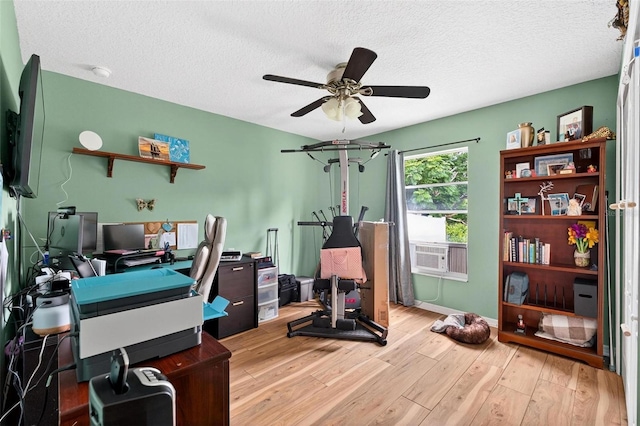 544 Lake Sumner Dr, Groveland, FL 34736 - office space featuring a ceiling fan, light wood-style flooring, a textured ceiling, and cooling unit