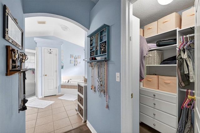 544 Lake Sumner Dr, Groveland, FL 34736 - bathroom with a bath and tile patterned floors