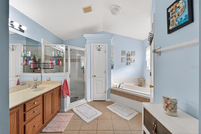 544 Lake Sumner Dr, Groveland, FL 34736 - bathroom featuring vanity, tile patterned flooring, a bath, a shower stall, and lofted ceiling