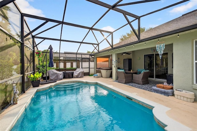 544 Lake Sumner Dr, Groveland, FL 34736 - swimming pool featuring a hot tub, ceiling fan, a patio area, outdoor lounge area, and a lanai