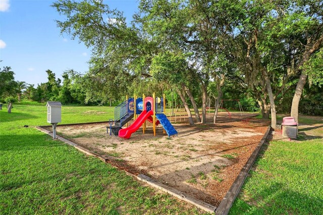 544 Lake Sumner Dr, Groveland, FL 34736 - communal playground featuring a yard and view of scattered trees