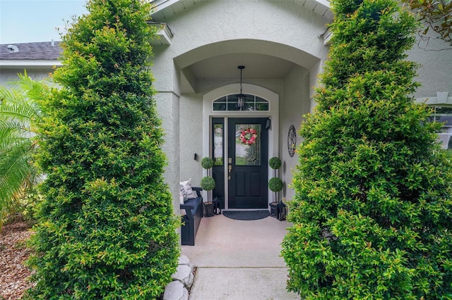 544 Lake Sumner Dr, Groveland, FL 34736 - doorway to property with stucco siding