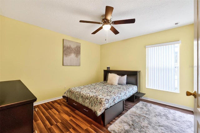 544 Lake Sumner Dr, Groveland, FL 34736 - bedroom with dark wood-type flooring, ceiling fan, and a textured ceiling