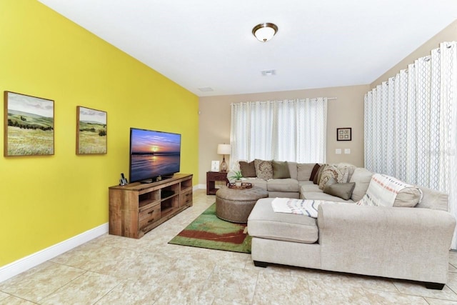 4123 Oaktree Dr, Davenport, FL 33837 - tiled living area featuring baseboards