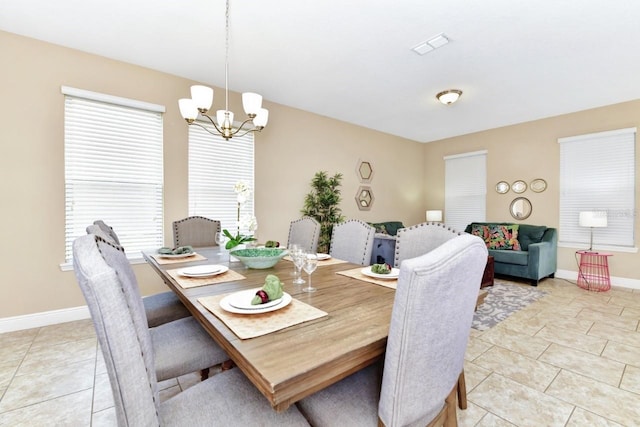 4123 Oaktree Dr, Davenport, FL 33837 - dining room with a chandelier, healthy amount of natural light, and light tile patterned flooring