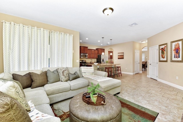 4123 Oaktree Dr, Davenport, FL 33837 - living area with arched walkways and recessed lighting