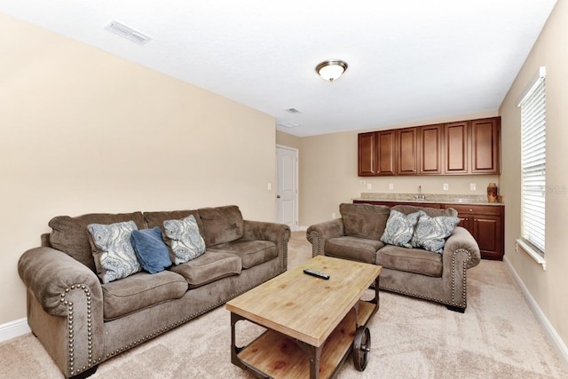 4123 Oaktree Dr, Davenport, FL 33837 - living room featuring wet bar and light carpet