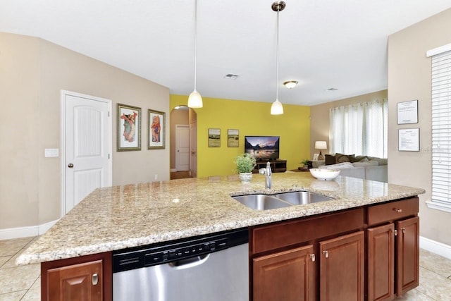 4123 Oaktree Dr, Davenport, FL 33837 - kitchen with dishwasher, open floor plan, light tile patterned flooring, a center island with sink, and light stone counters