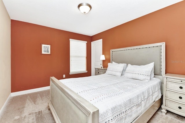 4123 Oaktree Dr, Davenport, FL 33837 - bedroom featuring light colored carpet and baseboards