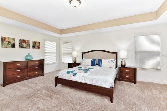 4123 Oaktree Dr, Davenport, FL 33837 - carpeted bedroom with baseboards and a tray ceiling