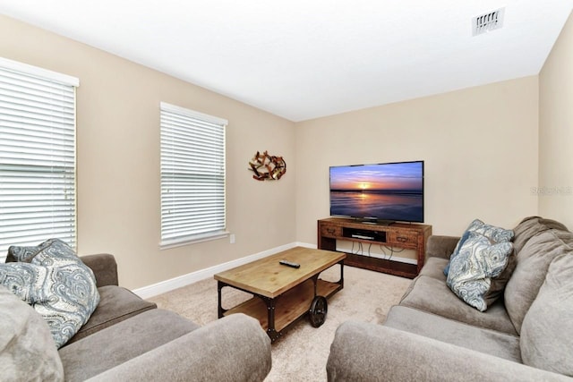 4123 Oaktree Dr, Davenport, FL 33837 - carpeted living area featuring healthy amount of natural light