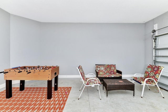 4123 Oaktree Dr, Davenport, FL 33837 - playroom featuring concrete flooring and baseboards