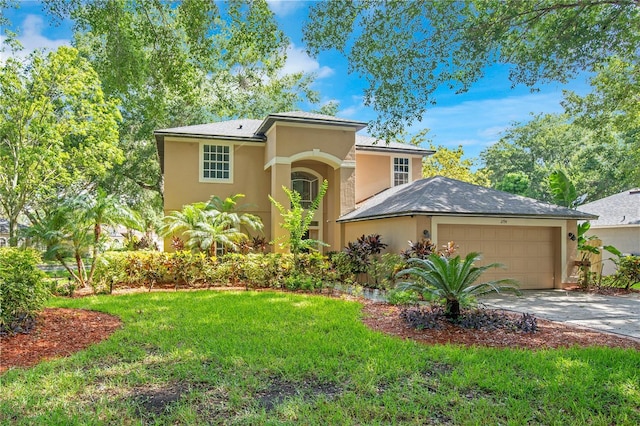 2794 Cullens Ct, Ocoee, FL 34761 - mediterranean / spanish house featuring stucco siding, concrete driveway, a garage, and a front lawn