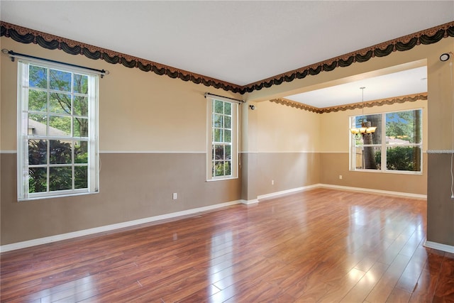 2794 Cullens Ct, Ocoee, FL 34761 - unfurnished room featuring a chandelier and wood-type flooring