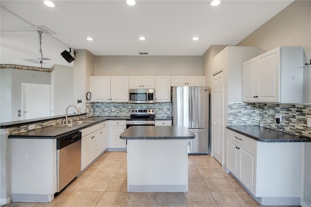 2794 Cullens Ct, Ocoee, FL 34761 - kitchen featuring appliances with stainless steel finishes, a peninsula, dark countertops, backsplash, and recessed lighting