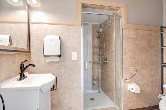 2794 Cullens Ct, Ocoee, FL 34761 - bathroom featuring a shower stall, vanity, and tile walls