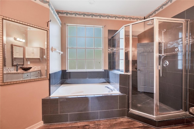 2794 Cullens Ct, Ocoee, FL 34761 - bathroom with a bath, a stall shower, vanity, and wood finished floors