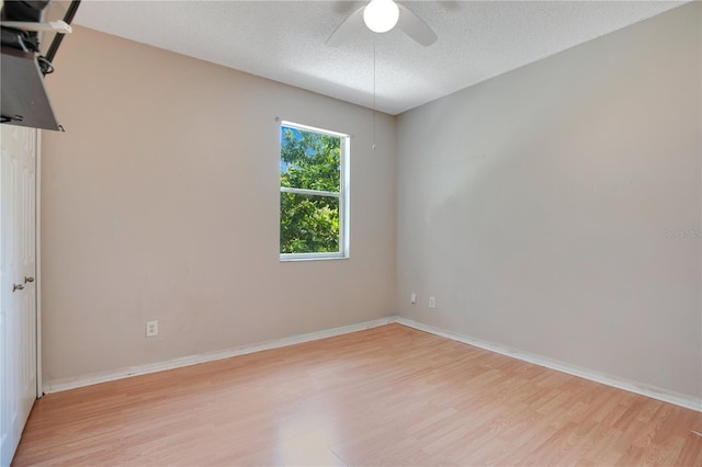 2794 Cullens Ct, Ocoee, FL 34761 - unfurnished room with light wood finished floors, a ceiling fan, and a textured ceiling
