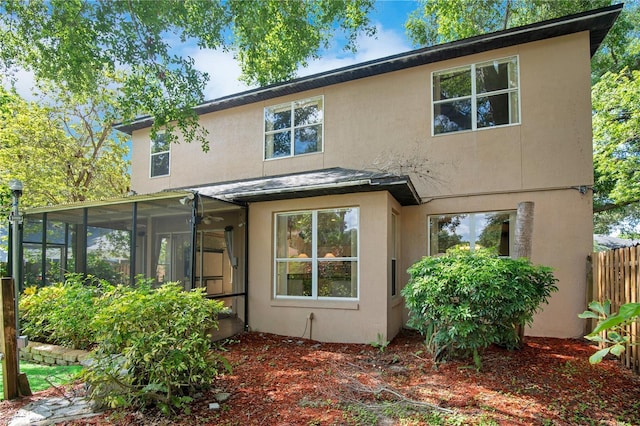 2794 Cullens Ct, Ocoee, FL 34761 - back of property featuring stucco siding and a sunroom