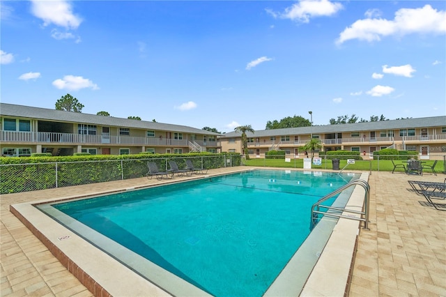 1100 E Caroline St Unit 204, Tavares, FL 32778 - community pool featuring a residential view and a patio area