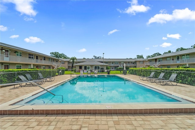 1100 E Caroline St Unit 204, Tavares, FL 32778 - community pool with a residential view and a patio