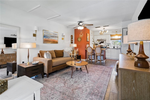 1100 E Caroline St Unit 204, Tavares, FL 32778 - living area with ceiling fan and hardwood / wood-style floors
