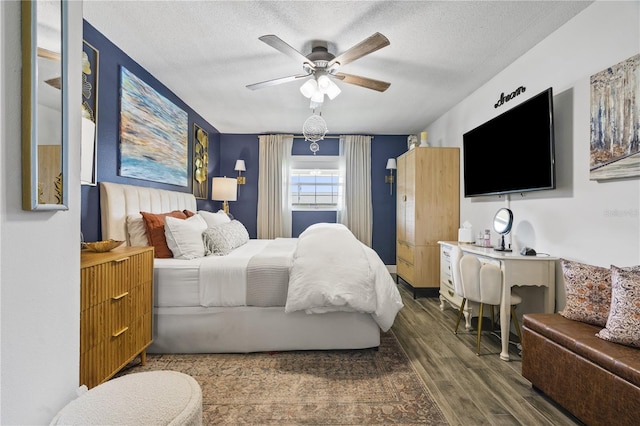1100 E Caroline St Unit 204, Tavares, FL 32778 - bedroom featuring wood finished floors, a textured ceiling, and ceiling fan