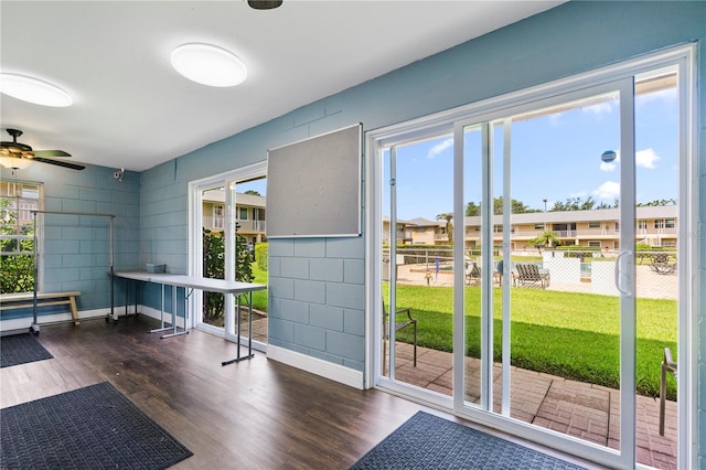 1100 E Caroline St Unit 204, Tavares, FL 32778 - doorway to outside featuring wood finished floors and ceiling fan