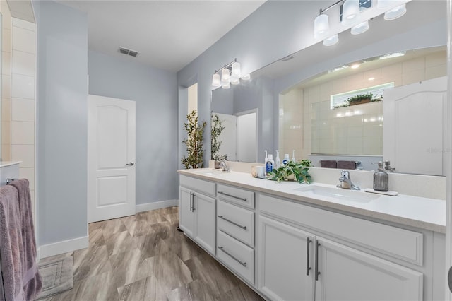 17676 Passionflower Cir, Clermont, FL 34714 - bathroom featuring double vanity and baseboards