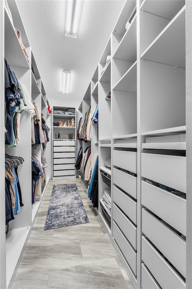17676 Passionflower Cir, Clermont, FL 34714 - walk in closet featuring light wood-style flooring