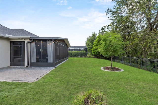17676 Passionflower Cir, Clermont, FL 34714 - fenced backyard with a sunroom and a patio