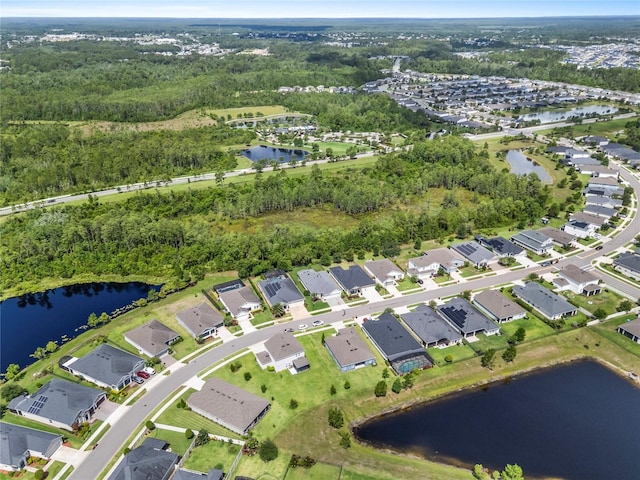 17676 Passionflower Cir, Clermont, FL 34714 - aerial view of residential area with a large body of water